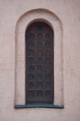 The window of an ancient cathedral. The architecture of ancient