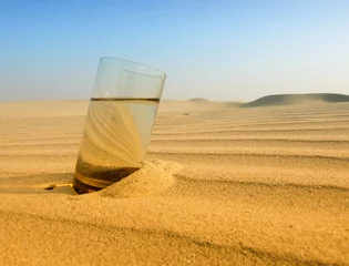 Zelfklevend Fotobehang glasses of water in the desert © Željko Radojko