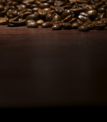 Coffee beans top of wooden table
