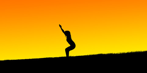 Obraz na płótnie Canvas silhouette of a beautiful girl practicing yoga