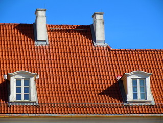 Red roof, white dormers and chimneys (Riga, Latvia)