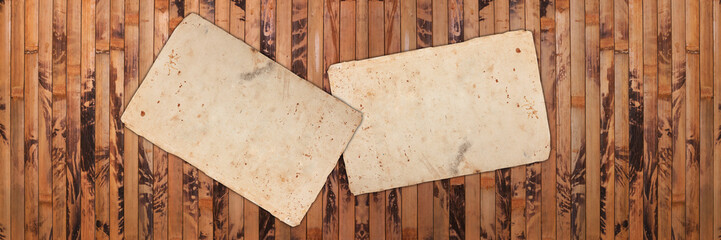Faded old papers on vintage wooden background
