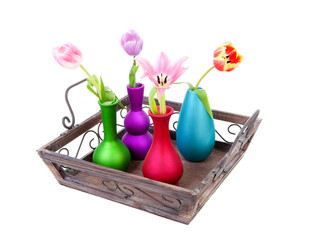Tray with colorful vases and Dutch tulips