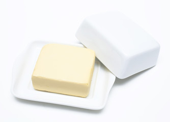 butter on white butterdish over white