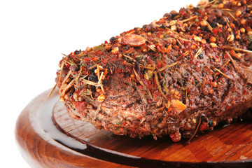 roast beef meat in spice on wood