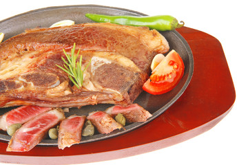 beef meat steak on metal iron plate