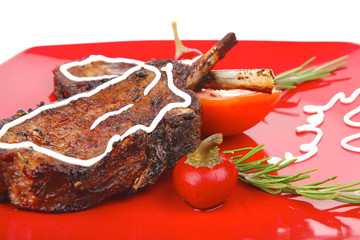 served entree: ribs on red plate