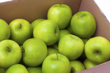 box full of green apples