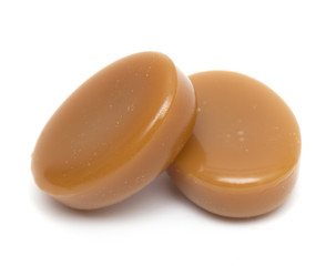 close up of two caramel candies