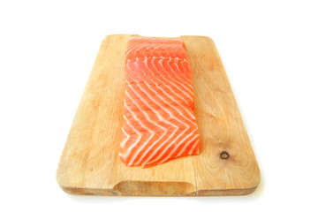 salmon fish piece on wooden tray isolated on white