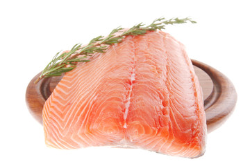 raw salmon fillet on wood and rosemary