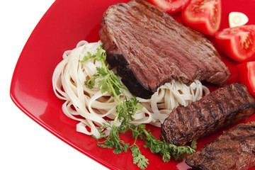 italian food : pasta with tomato and grilled sirloin