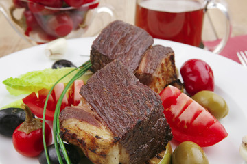 steak garnished with baked apples