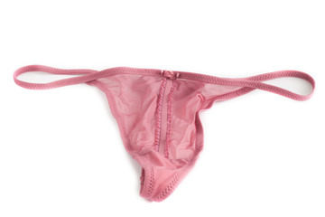 Woman's sexy and pink thong on white background - obrazy, fototapety, plakaty