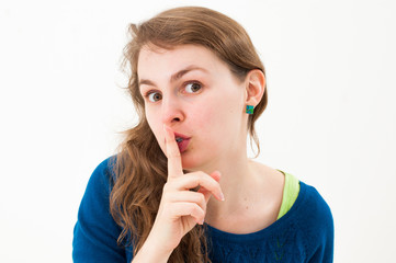 Naklejka premium young woman shows be quit sign