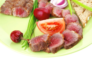 meat food : roast red meat slices served on green plate