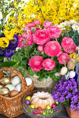 spring flowers with easter cake and eggs decoration