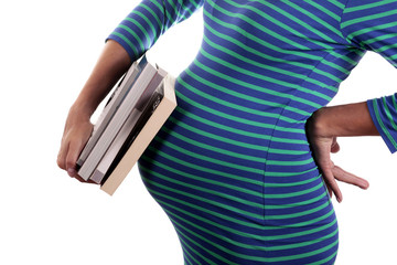 Pregnant woman carries stack of books