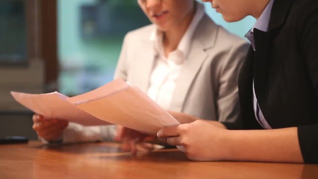 Business women working with documents in office