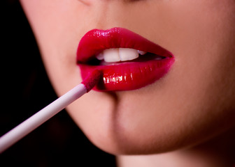 Naklejka premium Beautiful red gloss lips with brash