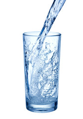 pouring water on glass on white background