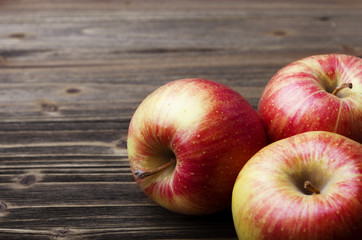 red apples on wooden table
