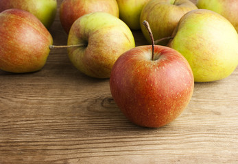 red apples on wooden table