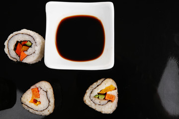 Roll with Avocado and Salmon on black