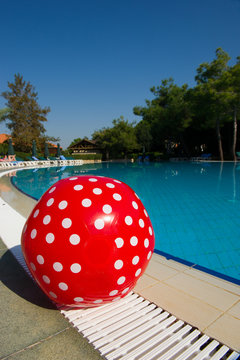 Red Beach Ball At Swimming Pool