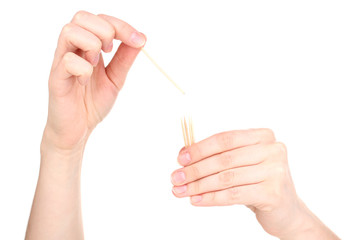 Hand throwing toothpick isolated on white