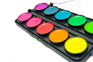 Box of watercolors close-up on white