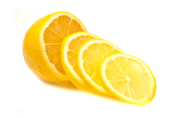 Lemon slices and lemon on white