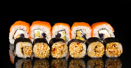 Tasty rolls in line isolated on black