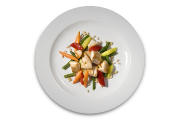 Chicken fillet with vegetables on plate, isolated on white