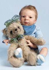 Adorable baby with teddy bear