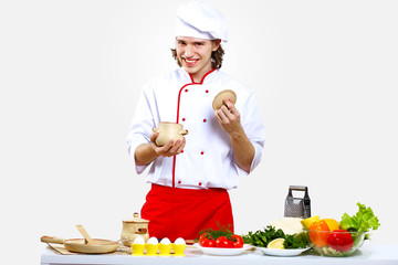 Portrait of a young cook in uniform