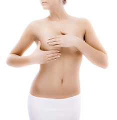 Fototapeta premium Woman examining her breast isolated on white background