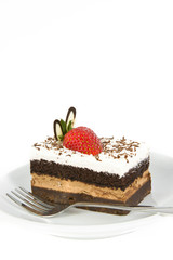 Piece of chocolate cake with strawberry decorate on top