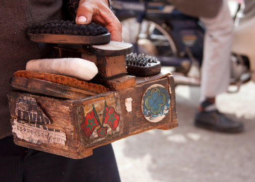 Man Holding Shoe Shine Box