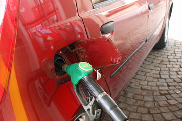 car makes a supply of green unleaded fuel distributor - obrazy, fototapety, plakaty