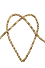 Heart Shaped Knot on a golden rope isolated