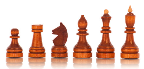 Chess. a group of black wooden chess pieces