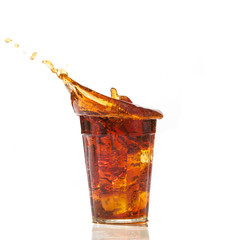 cola glass and cola splashing