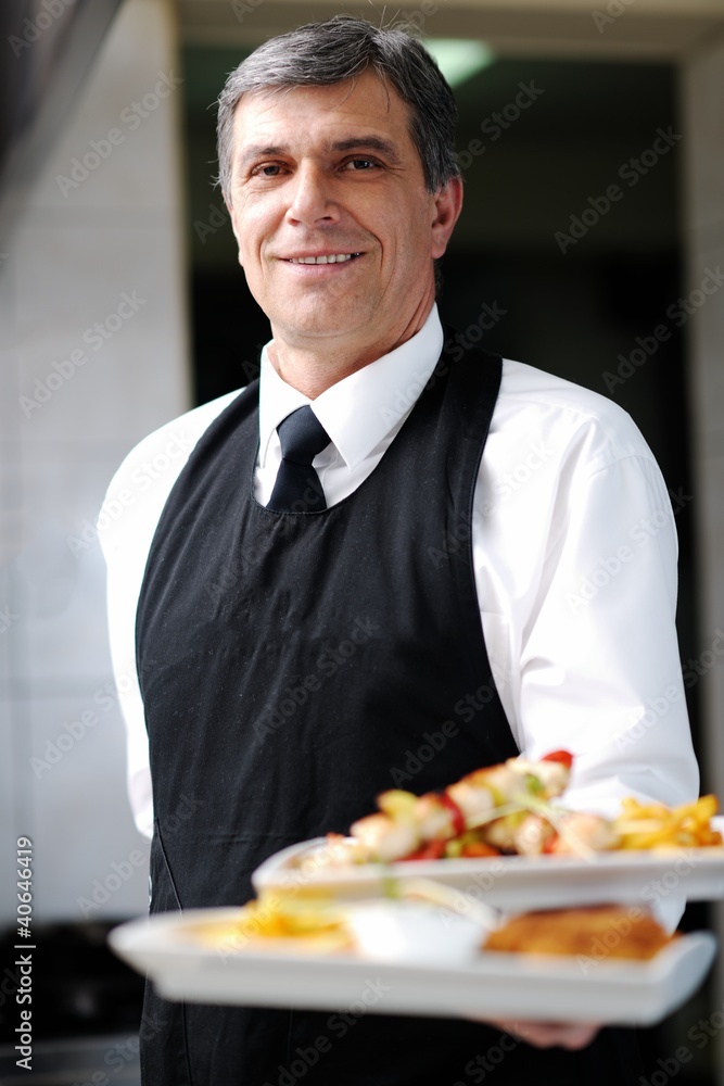 Canvas Prints male chef presenting food