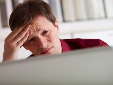 business man having headache in office