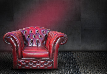 A red vintage chair on metal background