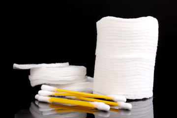 Cotton swabs and sticks isolated on black