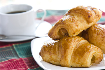 Breakfast with a cup of black coffee and croissants, Shallow DOF
