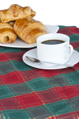Breakfast with a cup of black coffee and croissants, Shallow DOF
