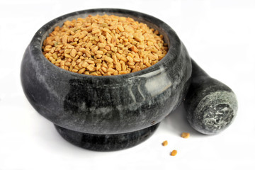 Fenugreek in a marble mortar and pestle